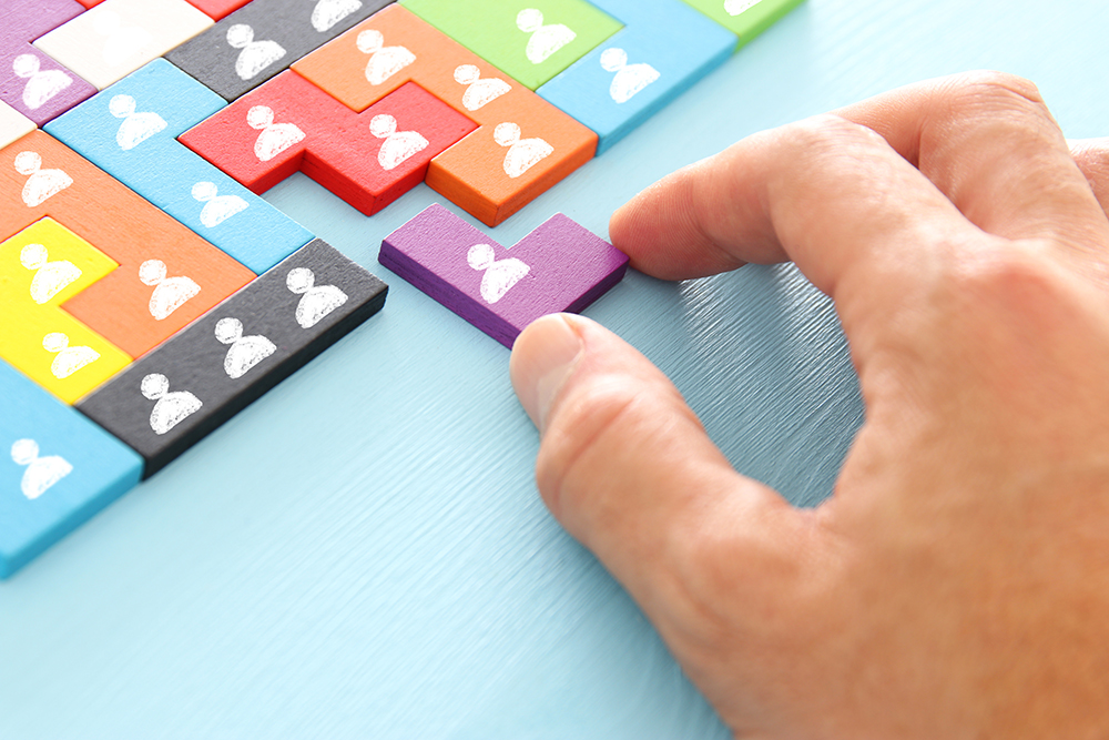 image of tangram puzzle blocks with people icons